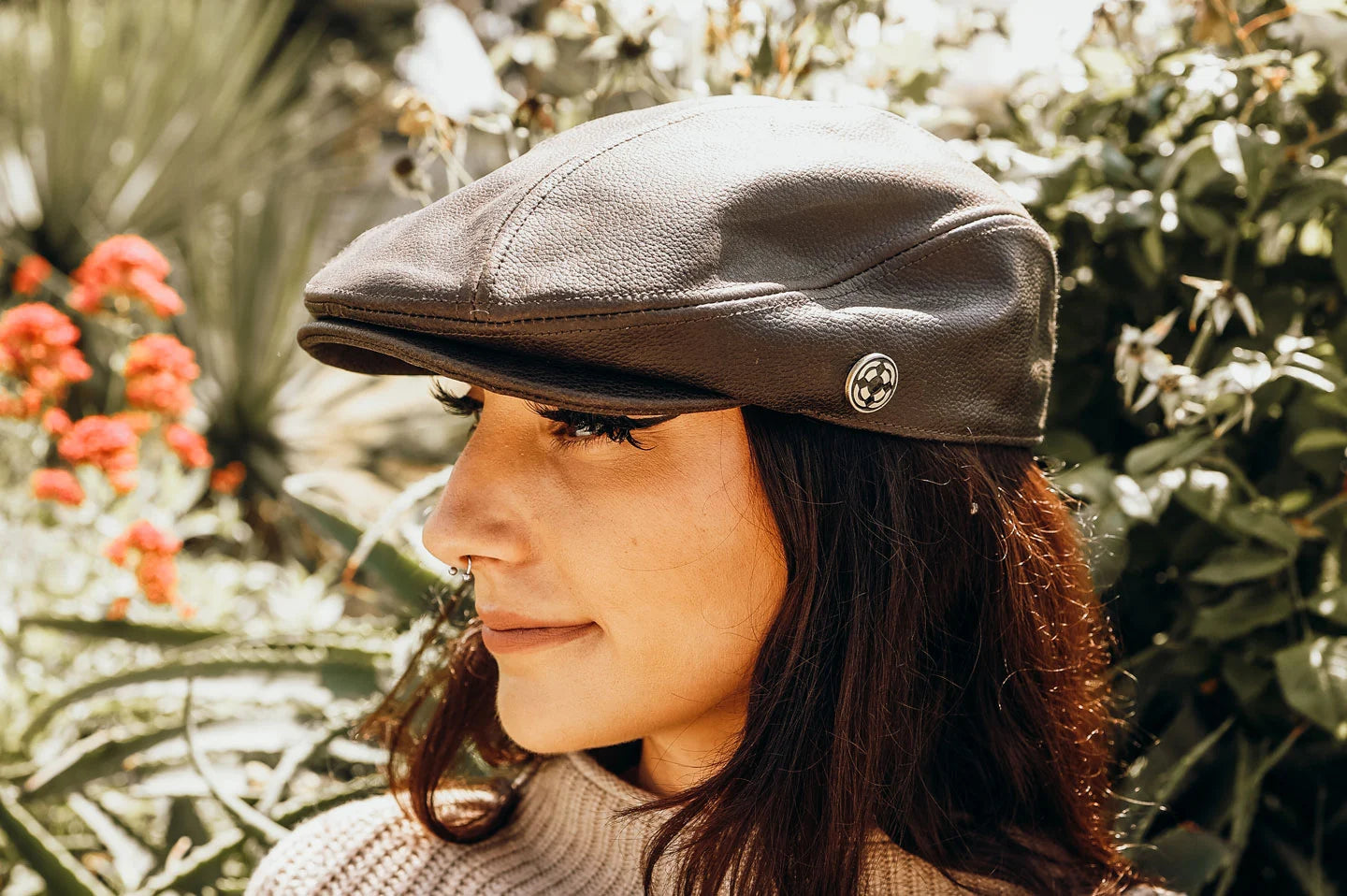 Woman in garden with the Bookie womens cap by American Hat Makers