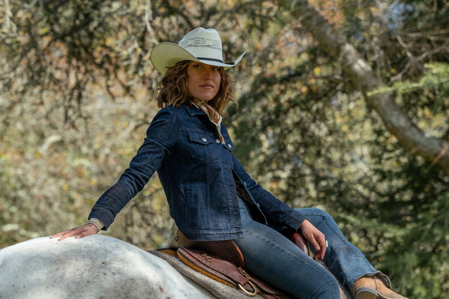 Woman sitting on horse wearing the Bozeman cowgirl hat by American Hat Makers