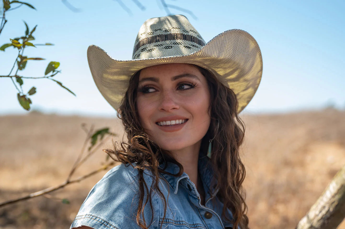 Woman wearing the Cisco cowgirl hat by American Hat Makers in a field