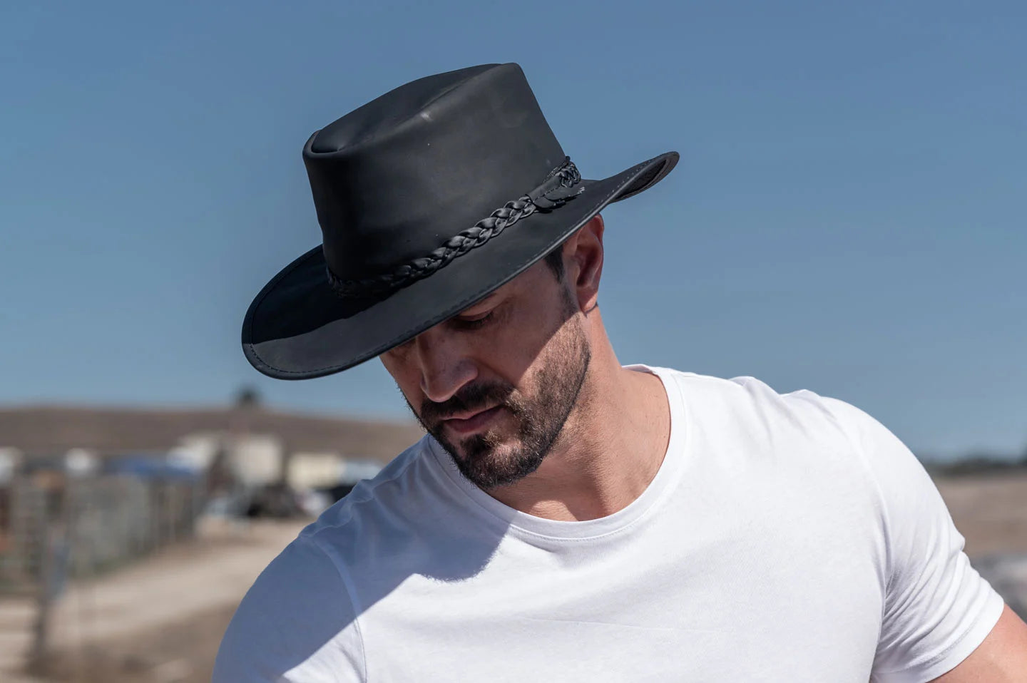 Man wearing the crusher mens black hat by American Hat Makers