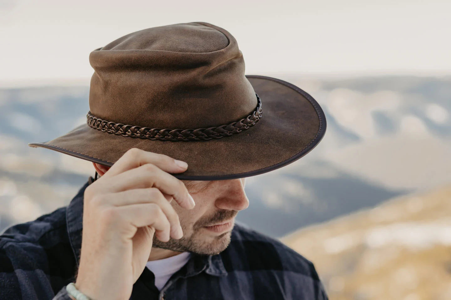 Man in hills wearing the crusher Australian outback hat by American Hat Makers