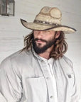 man looking away wearing a palm straw diego hat