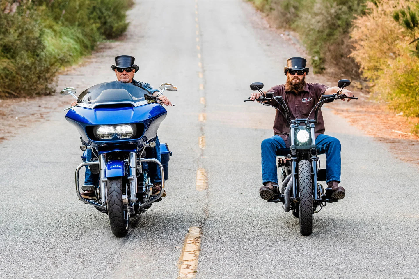 Two men on motorcycles riding with the El Dorado voodoo hatter top hat by American Hat Makers