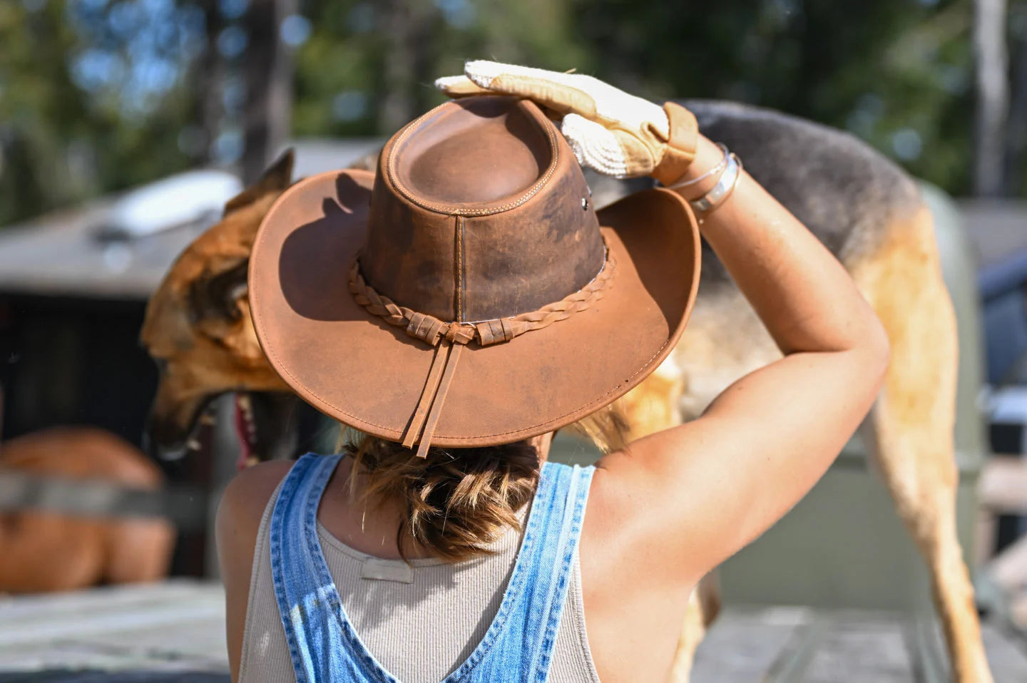 Woman with dog wearing the hollywood cowgirl hat by American Hat Makers