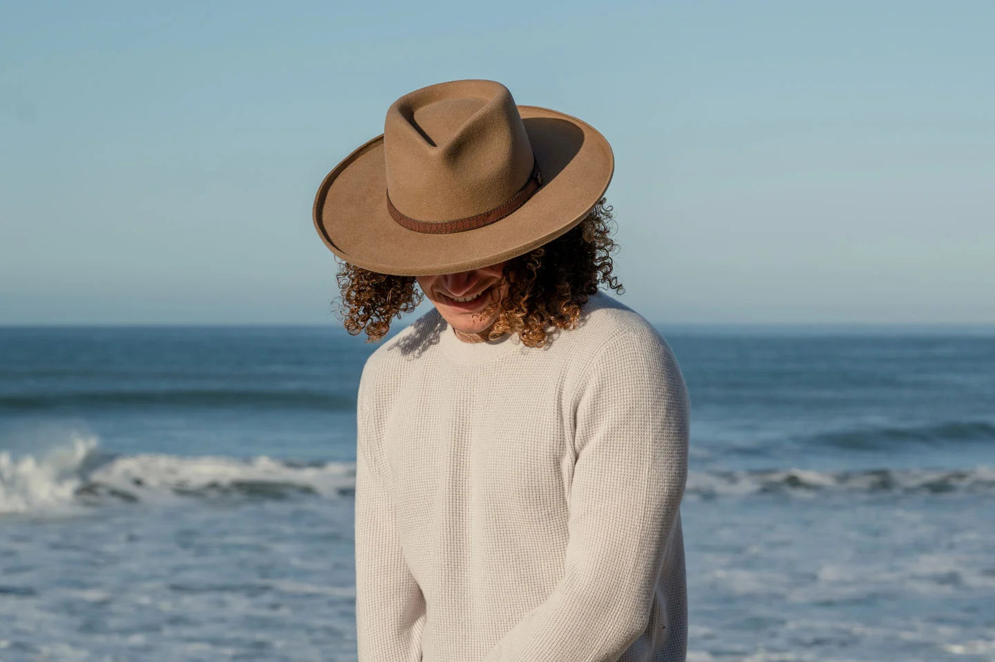 Man standing at beach wearing the Hudson mens wide brim hat by American Hat Makers