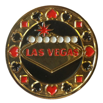A circular gold and black Las Vegas casino-themed pin or badge featuring the word 'LAS VEGAS' in red, playing card suit symbols, and white dots on a black center, isolated on a white background.