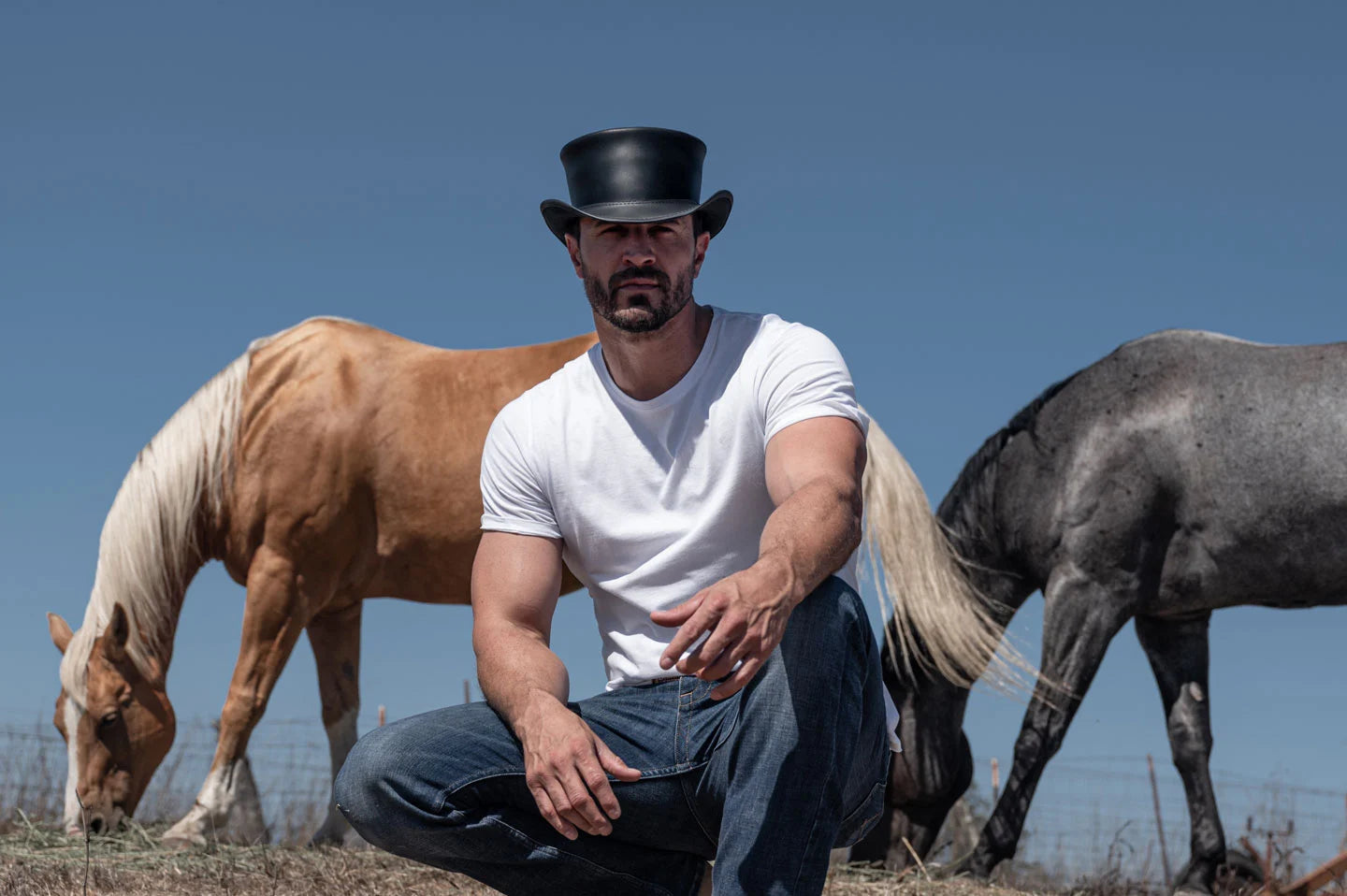 Man with horses in the Marlow mens black hat by American Hat Makers