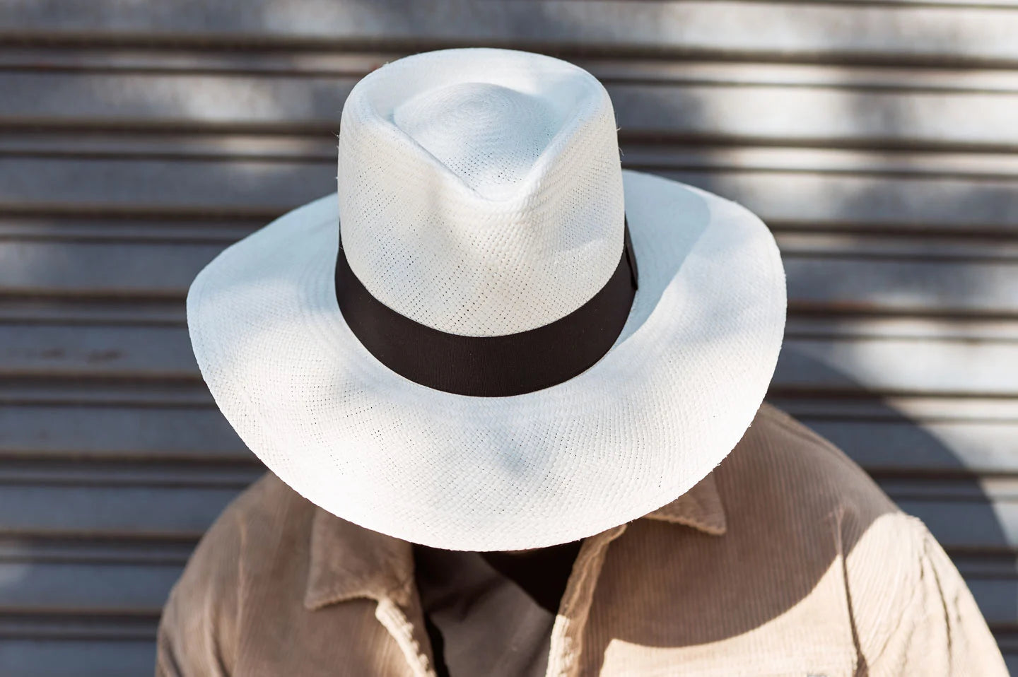 Man posing in the Medellin mens panama hat by American Hat Makers