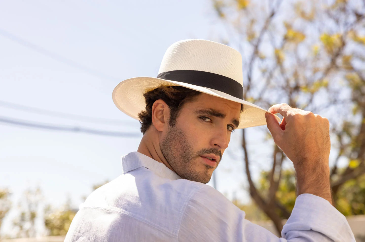 Man wearing Medellin White Straw Panama Sun Hat by American Hat Makers