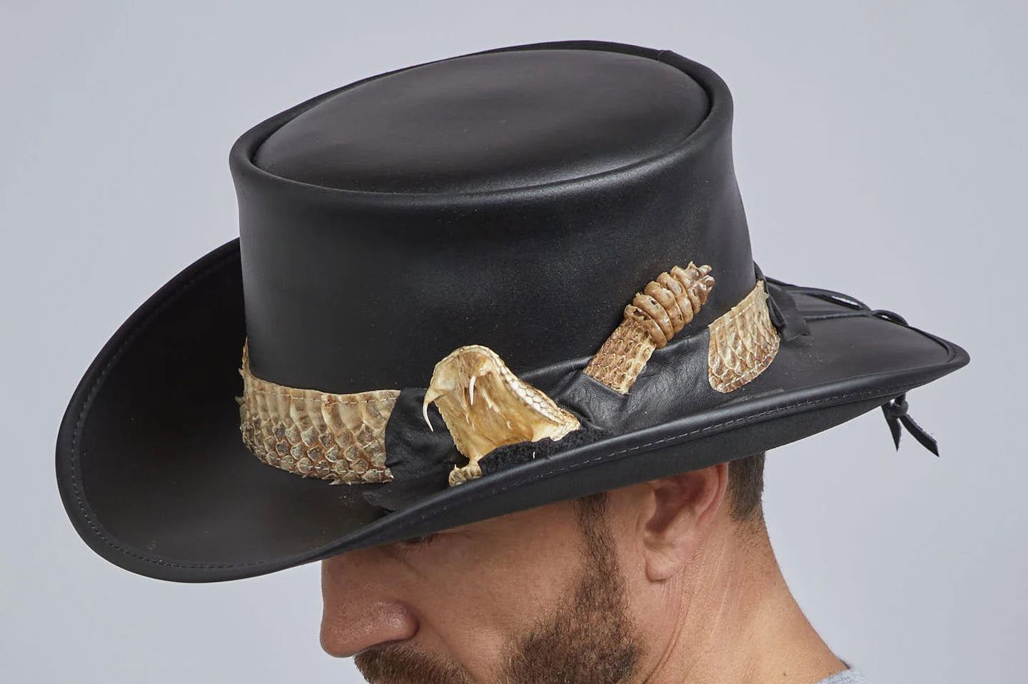 Man wearing the Pale rider with rattlesnake hat band by American Hat Makers