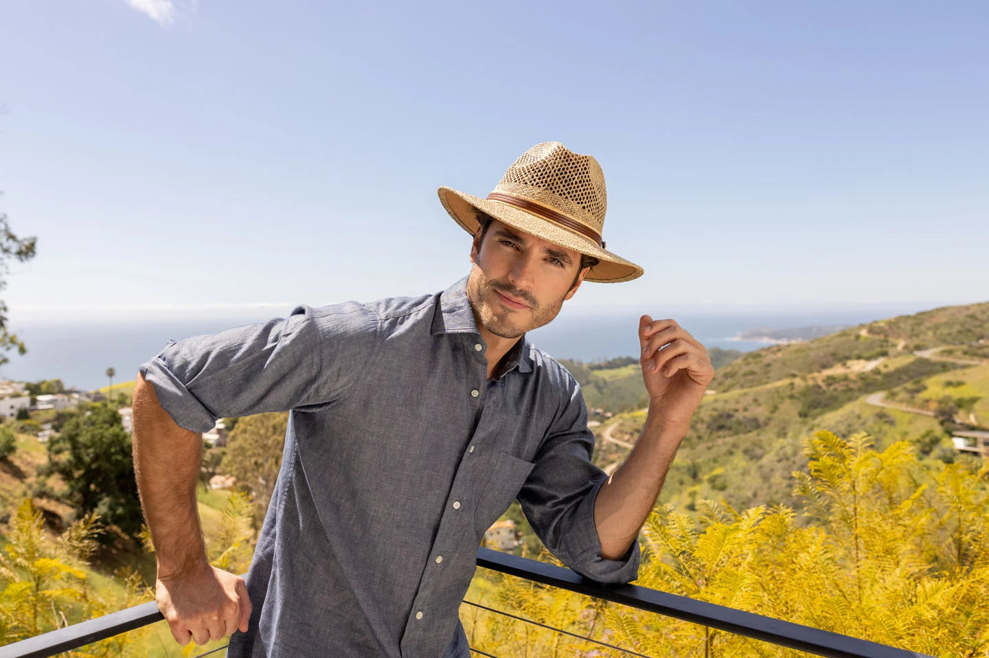 Man posing outside with the Seagrass mens hat by American Hat Makers