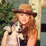 Shakira wearing a brown cowboy hat