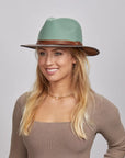 A blonde woman wearing a Sage Felt Fedora Hat and a beige fitted top.