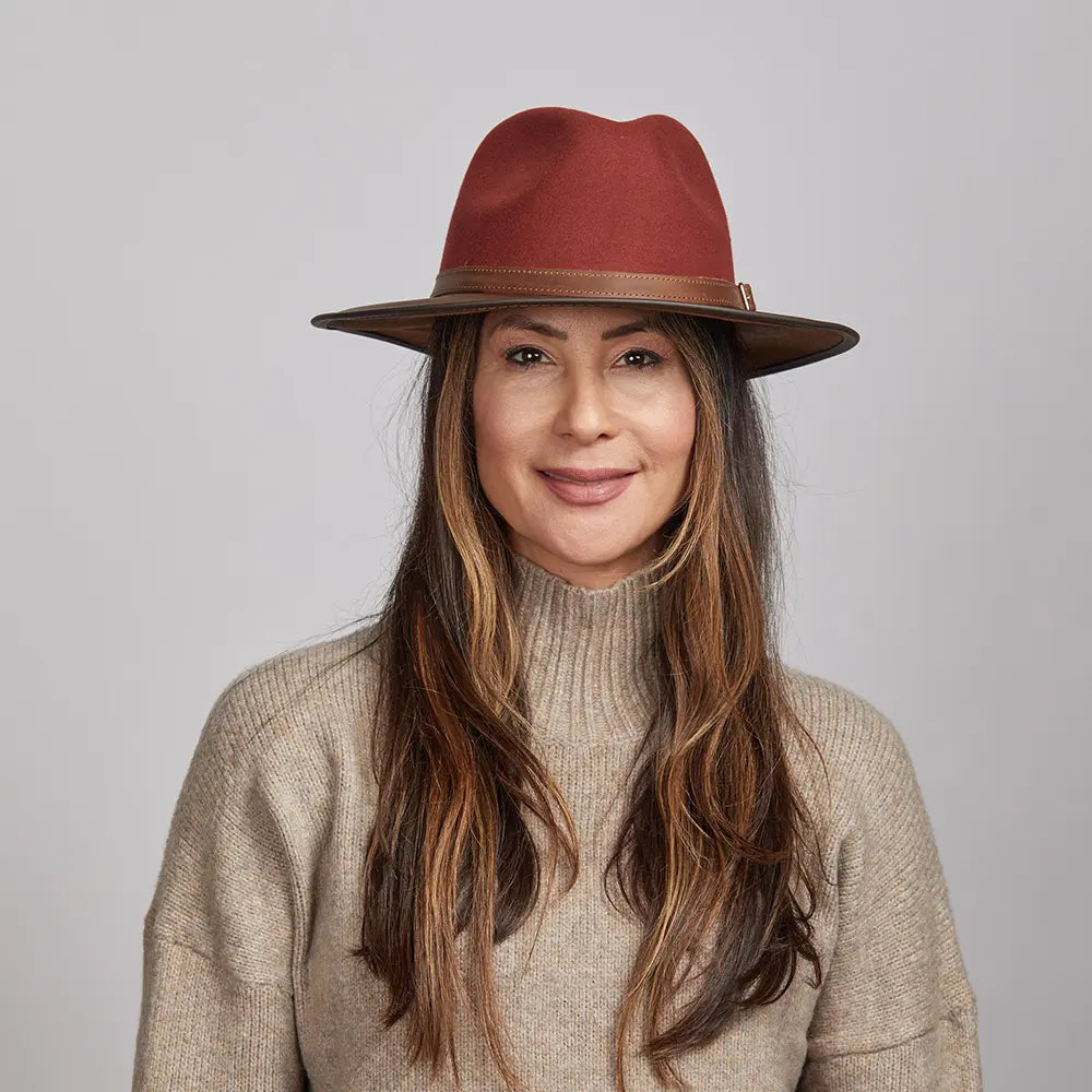 Woman wearing a Sangria Felt Fedora Hat and a beige turtleneck sweater.