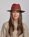 Woman wearing a Sangria Felt Fedora Hat and a beige turtleneck sweater.