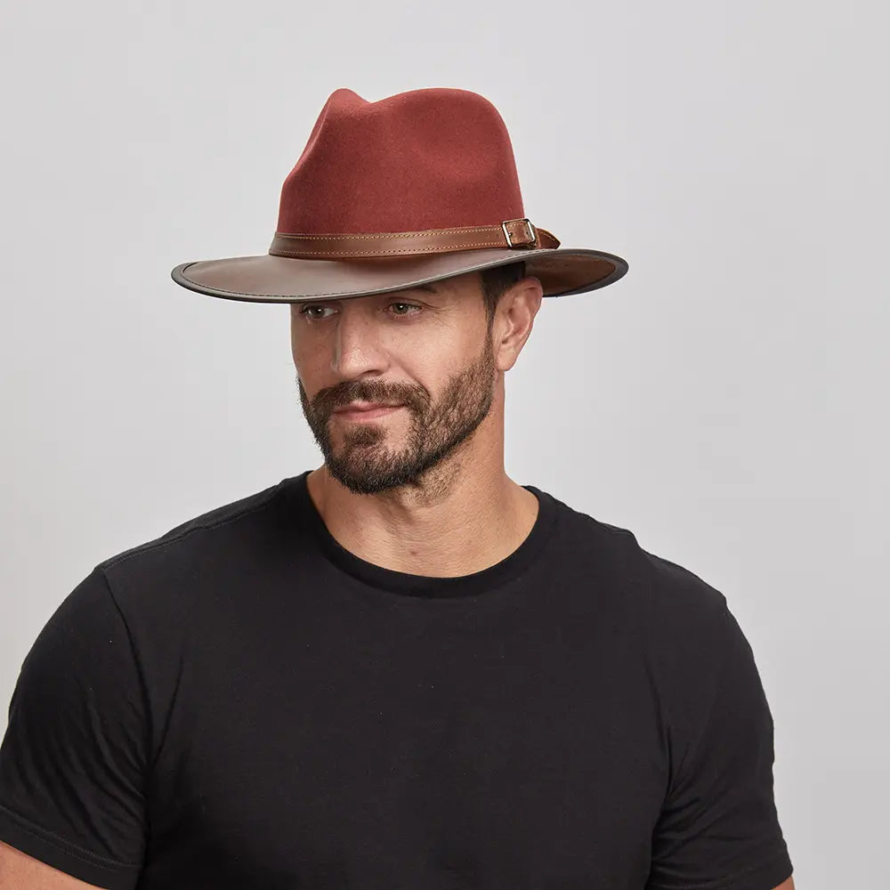 A man wearing the Summit Sangria Felt Leather Fedora Hat, looking slightly to the side.