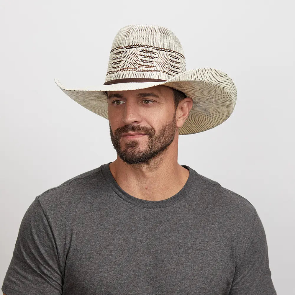 A man in gray shirt, looking slightly to the side, and wearing his Trail Boss Cowboy Hat