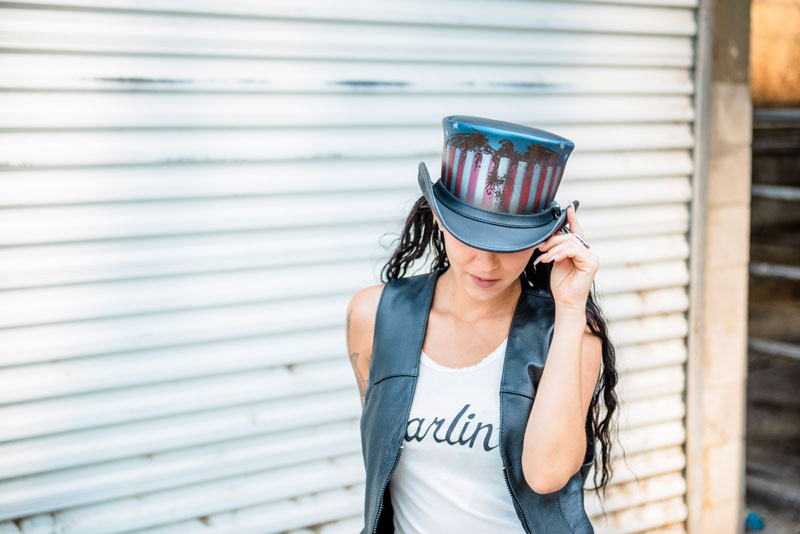 A woman wearing a USA freedom leather top hat
