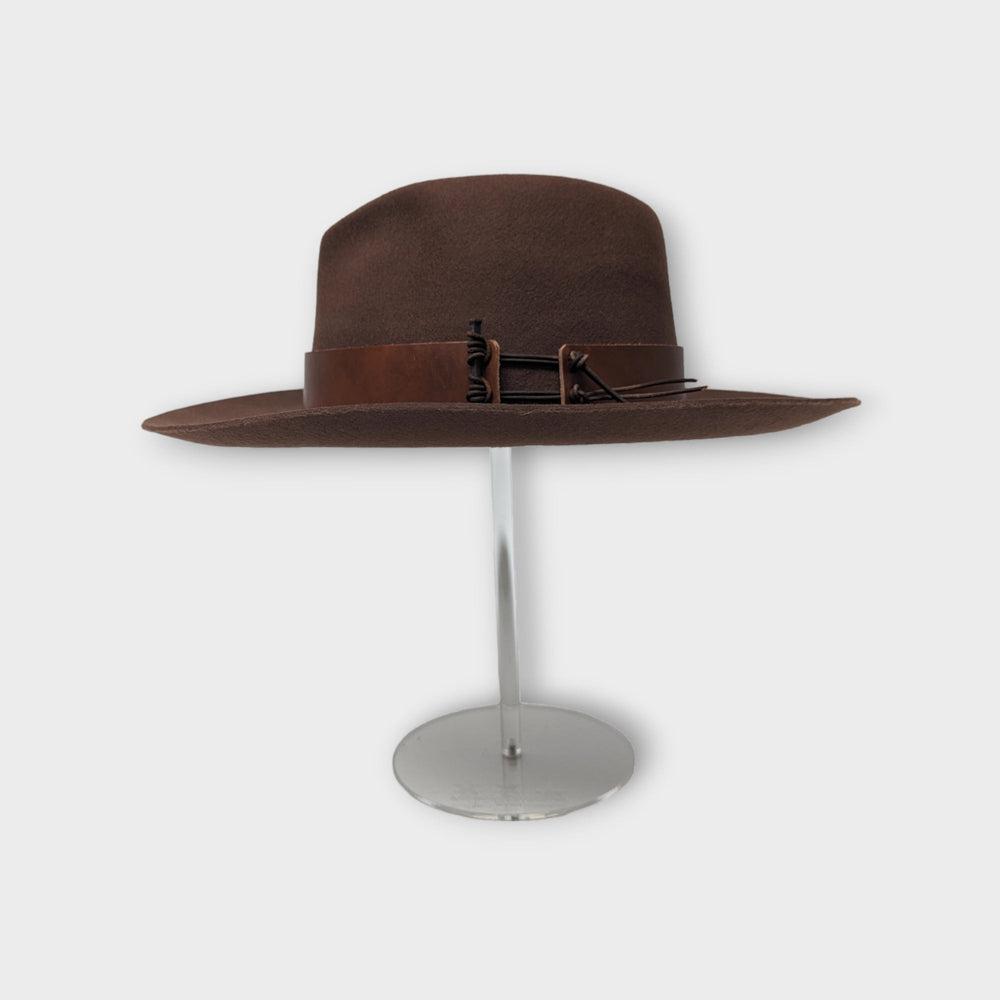 acrylic hat stand with hat on it