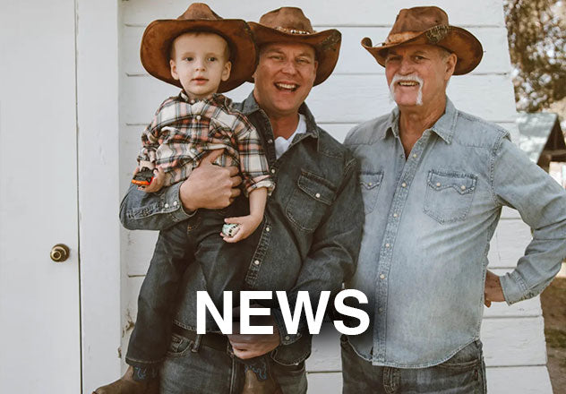 Gary, Garth and his son standing outdoors wearing brown leather hats