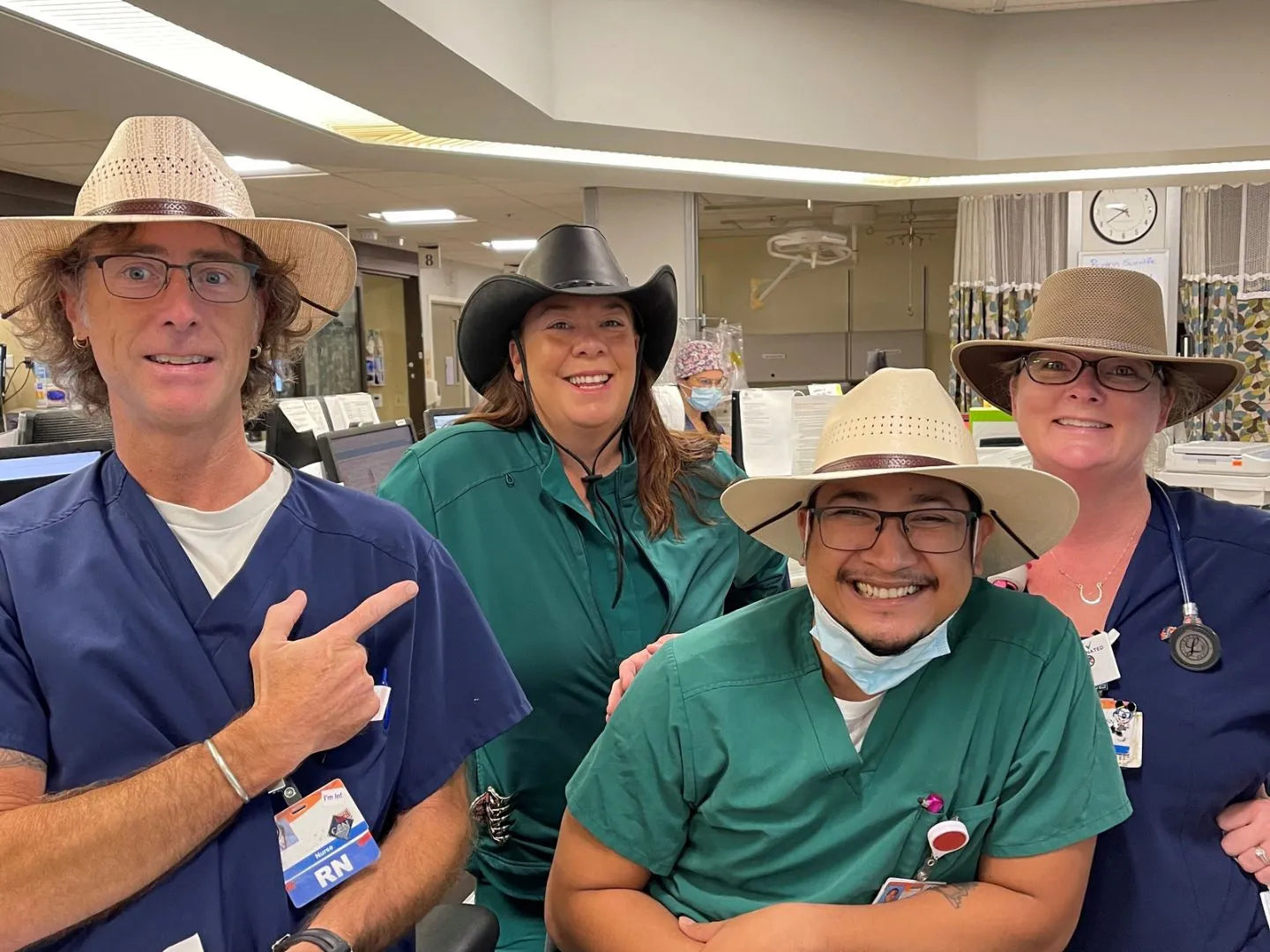 Nurses in scrub suits wearing hats made by American Hat Makers