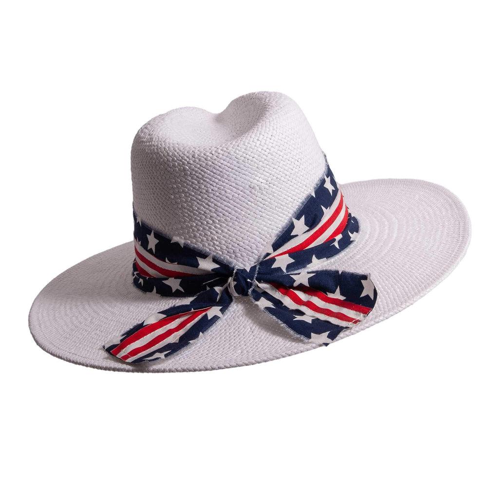 A front view of a Knox white straw sun hat with US flag designed hat band