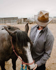 A man beside a horse wearing Burnt Honey Leather Cowboy Hat 