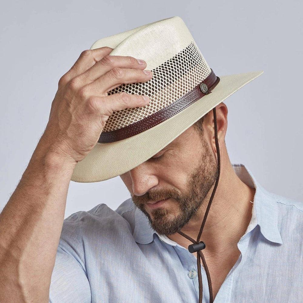 Man wearing cream Milan straw sun hat by American Hat Makers