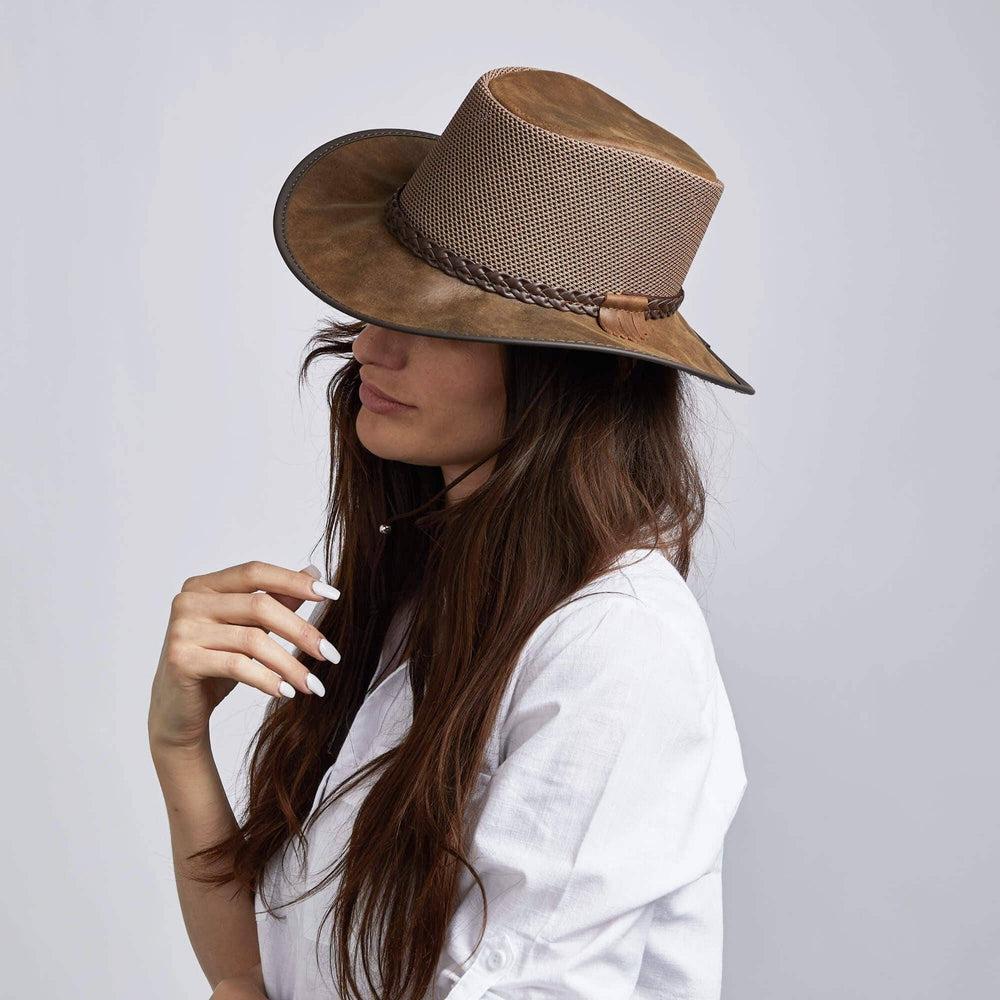 A woman on white polo and a brown Leather Mesh Sun Hat