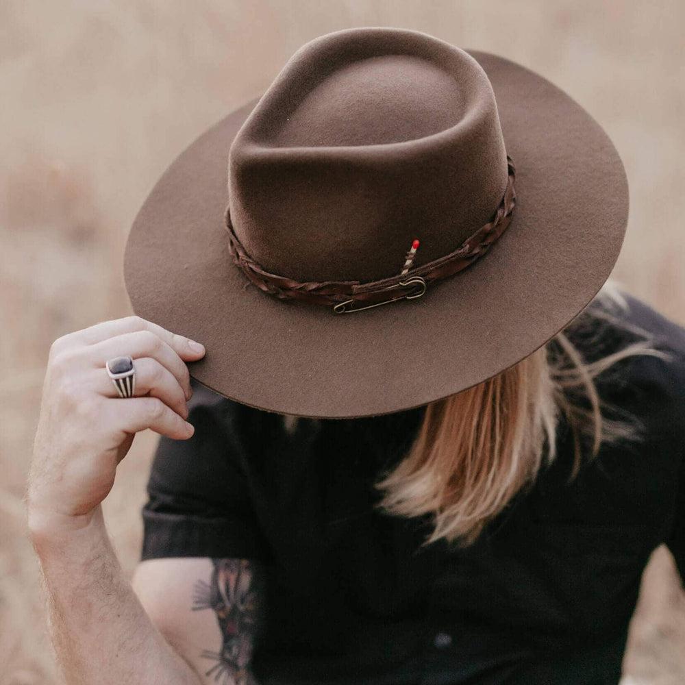 Narrow brimmed felt sales hat with dented crown