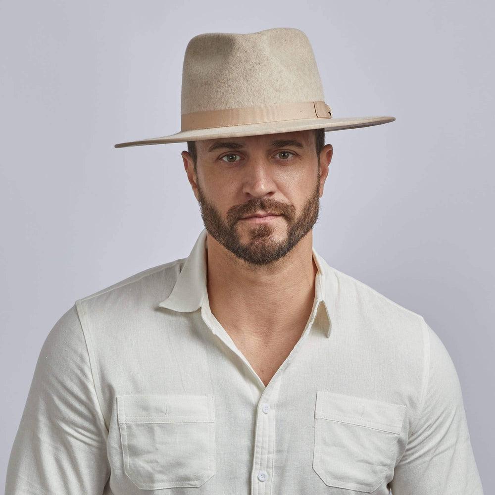 A man wearing Bondi Oatmeal Wide Brim Felt Fedora Hat 