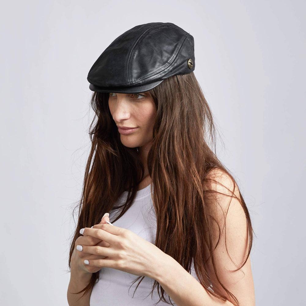 A woman wearing Leather Black Flat Cap on an angle view