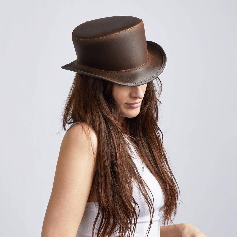 A woman wearing Bromley Unbanded Brown Leather Top Hat on a side view