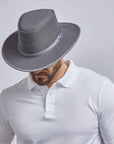 A man looking downwards wearing Cabana Steel Mesh Sun Hat with UPF Rating 