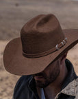 A man wearing Brown Cattleman Felt Cowboy Hat 