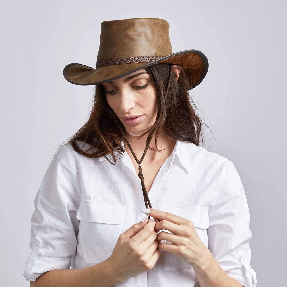 A woman wearing Bomber Brown Outback Leather Hat 