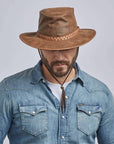 A man in denim jacket wearing Crusher Copper Outback Leather Hat on a front view