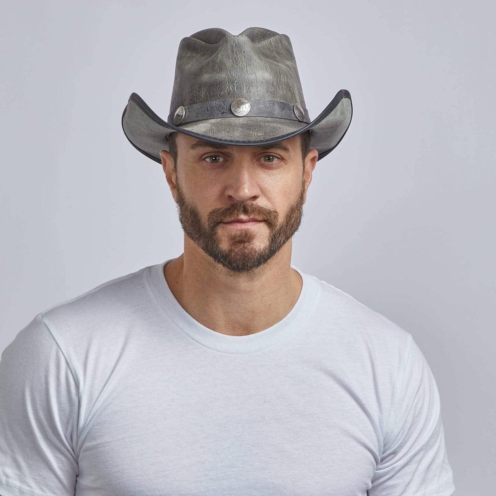 A man wearing Cyclone Asphalt Leather Cowboy Hat with 3&quot; Brim and 4&quot; Crown 
