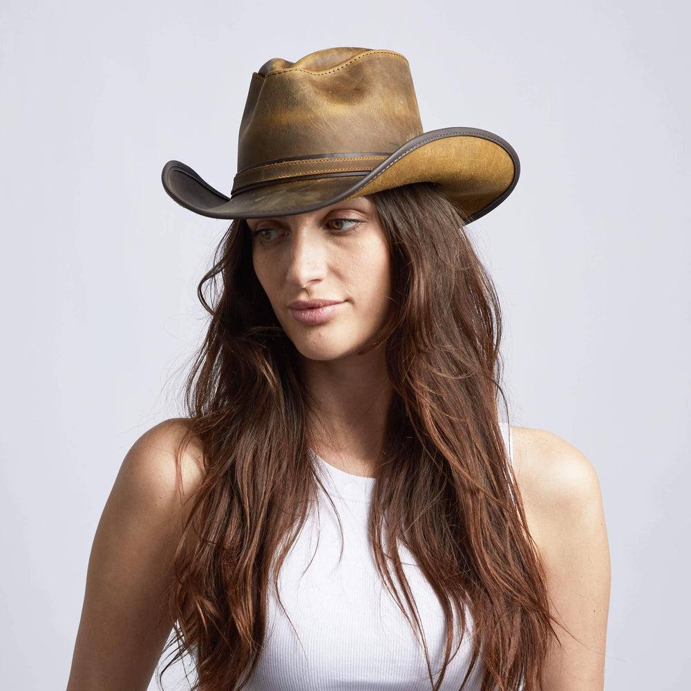 A woman in white tops wearing Burnt Honey Leather Cowboy Hat on an angle view
