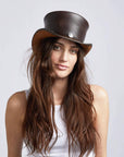 A woman with long hair wearing El Dorado Brown Leather Top Hat