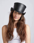 A woman in white tops wearing Black Leather Top Hat 
