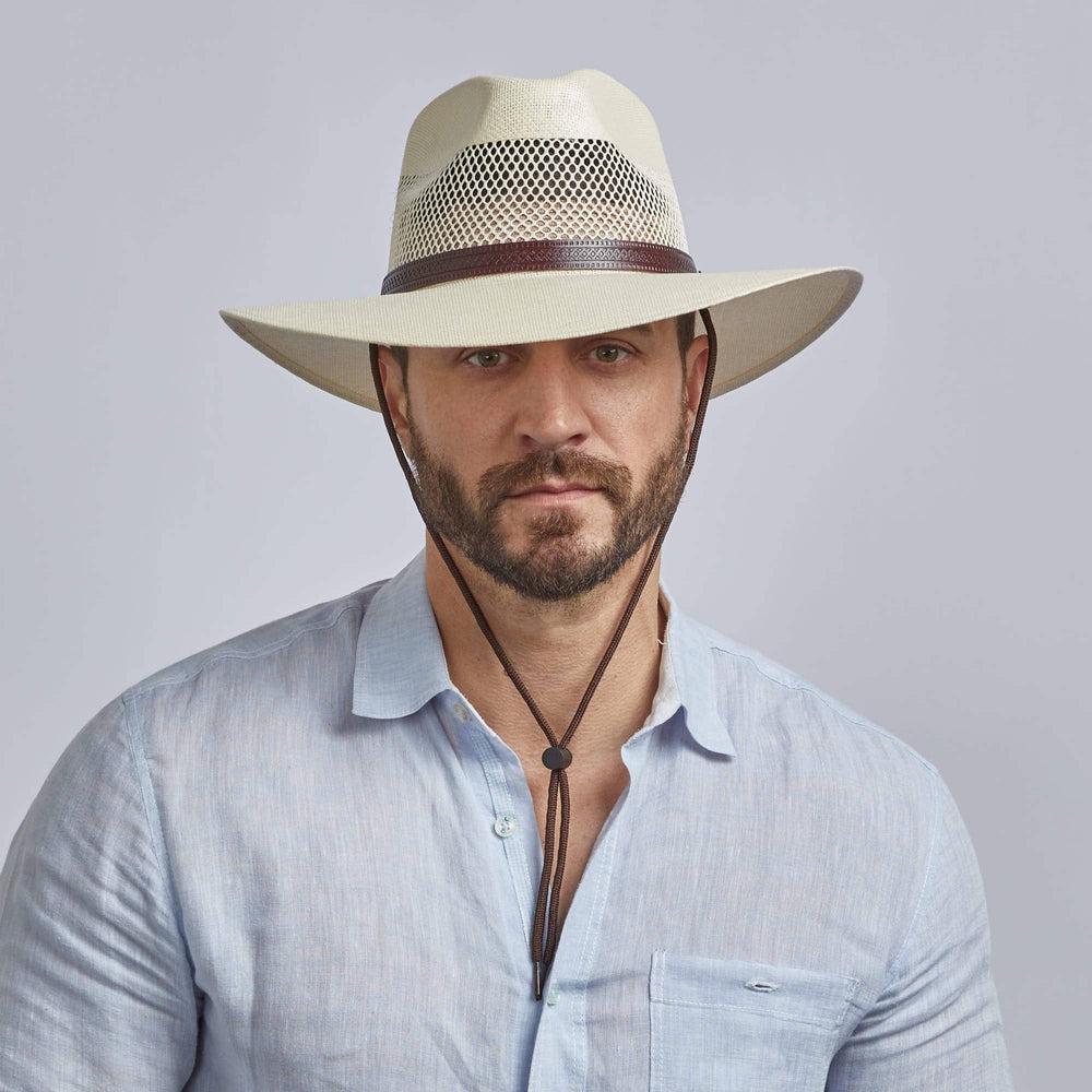 A man wearing Mens Florence Cream Wide Brim Straw Sun Hat on a front view