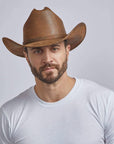 A man wearing Gorge Leather Cattleman Brown Cowboy Hat 