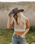 A woman standing outdoors wearing Brown Leather Cowboy Hat 