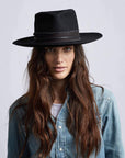 A woman wearing Jawa Black Wide Brim Felt Fedora hat
