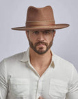A man wearing Jawa Brown Felt Fedora Hat
