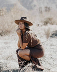 A woman wearing Brown Wide Brim Felt Fedora Hat