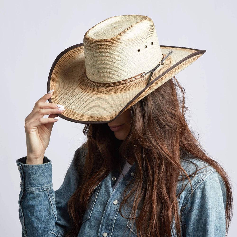 A woman wearing Laredo Straw Tan Cowboy Hat on an angle view 