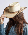 A woman wearing Laredo Straw Tan Cowboy Hat on an angle view 