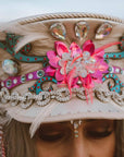 A woman wearing Lola Silver Burning Man Hat on a front view